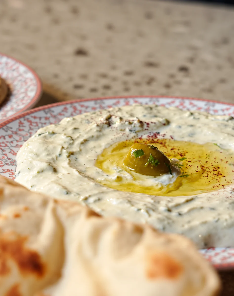 A plate of Mezze's tzatziki with pita